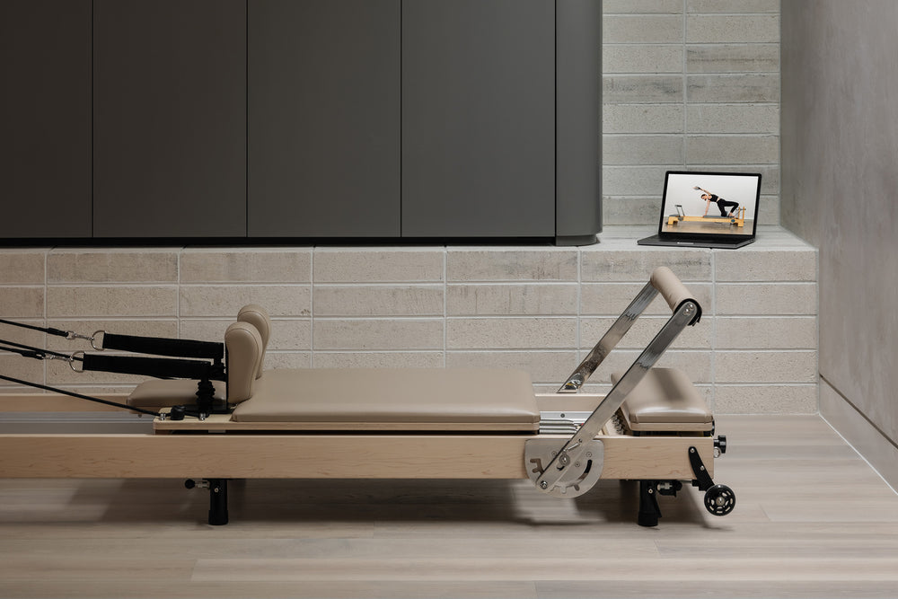 Ivory Upholstery YR Original Reformer - Side Profile View | Your Reformer
