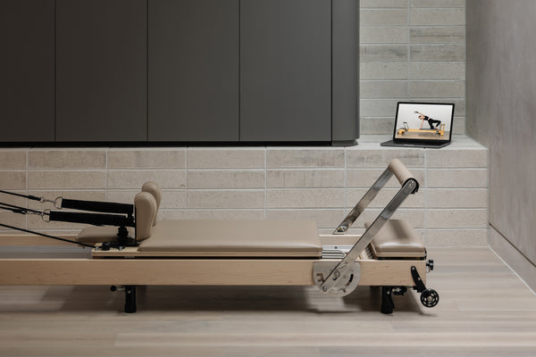 Ivory Upholstery YR Original Reformer - Side Profile View | Your Reformer