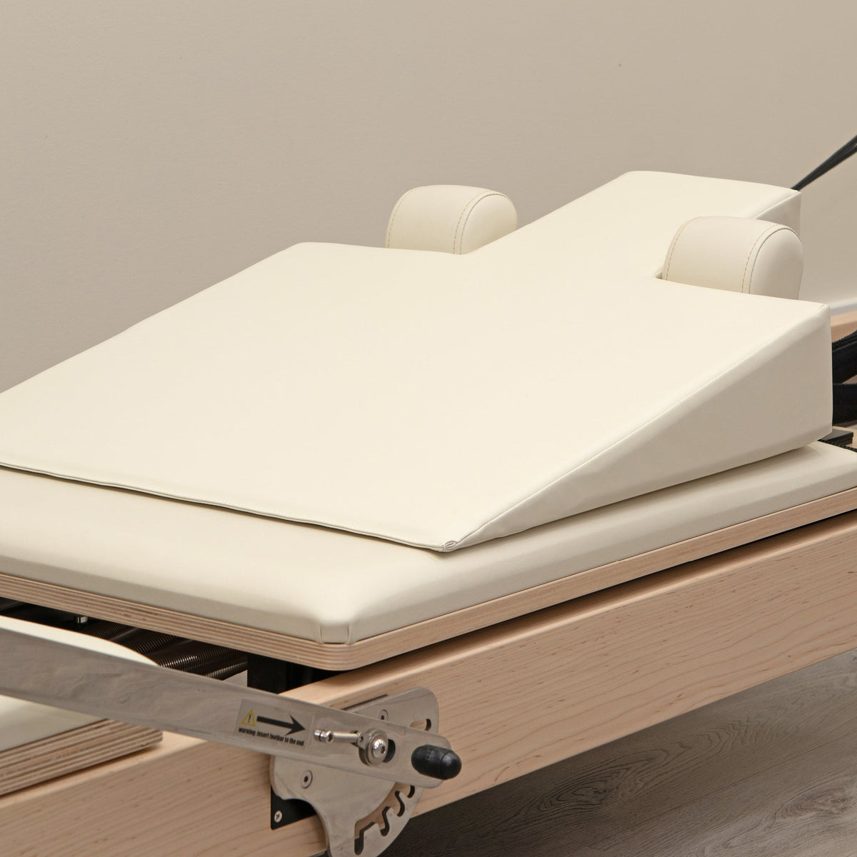 Ivory Pregnancy Wedge on Pilates Reformer - Top View | Your Reformer