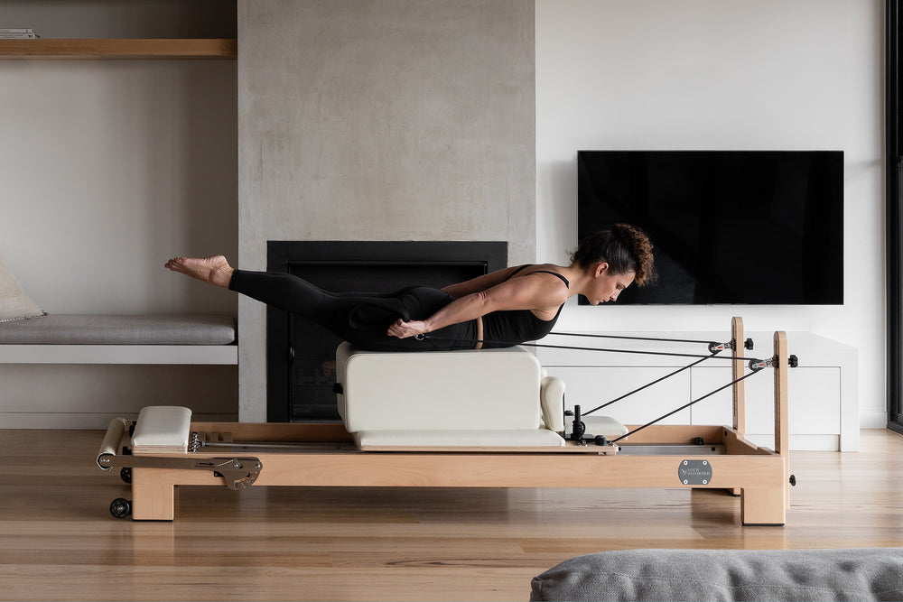 Mocha Wood YR Studio Pilates Reformer - Side View in Modern Home Studio | Your Reformer